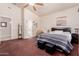 Comfortable bedroom with neutral walls, plush carpet, a ceiling fan, and ensuite bathroom at 4252 E Desert Sky Ct, Cave Creek, AZ 85331