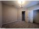 A carpeted bedroom featuring modern lighting and direct access to the closet at 4252 E Desert Sky Ct, Cave Creek, AZ 85331