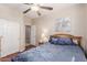 Comfortable bedroom with a ceiling fan, closet and ensuite bathroom entrance at 4252 E Desert Sky Ct, Cave Creek, AZ 85331