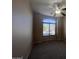 A carpeted bedroom with modern ceiling fan and large window providing natural light at 4252 E Desert Sky Ct, Cave Creek, AZ 85331