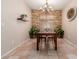 Cozy dining room with a decorative stone wall, chandelier, and ample natural light at 4252 E Desert Sky Ct, Cave Creek, AZ 85331