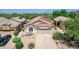 Aerial view of desert home featuring a terra cotta roof, neutral stucco, and well-maintained landscaping at 4252 E Desert Sky Ct, Cave Creek, AZ 85331