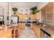 A spacious kitchen featuring stainless steel appliances, granite counters, wooden cabinets, and stylish decor at 4252 E Desert Sky Ct, Cave Creek, AZ 85331