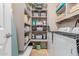 Well-organized laundry room with shelving and newer appliances at 4252 E Desert Sky Ct, Cave Creek, AZ 85331