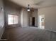 A spacious carpeted main bedroom with a ceiling fan and an ensuite bathroom access at 4252 E Desert Sky Ct, Cave Creek, AZ 85331
