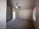 A carpeted main bedroom with neutral walls, and a doorway to the main bathroom at 4252 E Desert Sky Ct, Cave Creek, AZ 85331