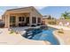 Inviting pool area featuring a covered patio, clear blue water, and comfortable outdoor seating at 4252 E Desert Sky Ct, Cave Creek, AZ 85331