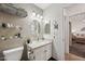 Well-lit bathroom with contemporary vanity, toilet and shelving for organized storage at 602 N May St # 29, Mesa, AZ 85201