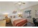Inviting bedroom with a vaulted ceiling, large window, and warm decor at 602 N May St # 29, Mesa, AZ 85201