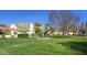 Well-maintained community lawn, complete with picnic tables, lush green grass, and charming desert landscaping at 602 N May St # 29, Mesa, AZ 85201