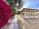 Community pavilion with outdoor seating surrounded by desert landscaping and colorful bougainvillea at 602 N May St # 29, Mesa, AZ 85201