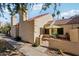 Charming exterior view showcasing the home's architecture, landscaping, and inviting patio area at 602 N May St # 29, Mesa, AZ 85201