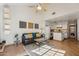 Bright living room with fireplace, comfortable sofa, and an open floor plan to the kitchen at 602 N May St # 29, Mesa, AZ 85201
