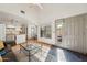Bright living room showcasing an open floor plan, with kitchen, dining area, and patio access at 602 N May St # 29, Mesa, AZ 85201