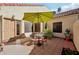 Outdoor patio area with dining set and umbrella, perfect for relaxing or entertaining at 602 N May St # 29, Mesa, AZ 85201