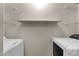 Convenient laundry area with ample shelving and space for a washer and dryer at 623 W Guadalupe Rd # 288, Mesa, AZ 85210