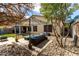 Outdoor patio with an overhead pergola and well manicured landscaping at 6461 S Kimberlee Way, Chandler, AZ 85249