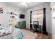 Cozy bedroom with desk, ceiling fan and accent wall art at 6461 S Kimberlee Way, Chandler, AZ 85249
