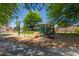 Shady community playground with green climbing structures and a slide for neighborhood children at 6461 S Kimberlee Way, Chandler, AZ 85249