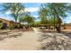 Brick walking path through a neighborhood park with mature trees and manicured landscaping at 6461 S Kimberlee Way, Chandler, AZ 85249