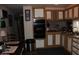 Functional kitchen design with natural lighting and dark countertops at 7807 E Main St # F-30, Mesa, AZ 85207