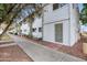 Exterior street view of apartments with well-kept landscaping in the front at 815 N Hayden Rd # B110, Scottsdale, AZ 85257