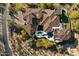 Aerial view of luxury estate featuring pool, water features, and lush landscape at 9290 E Thompson Peak Pkwy # 470, Scottsdale, AZ 85255