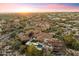 Expansive estate home with desert landscaping, and resort-style amenities at sunset at 9290 E Thompson Peak Pkwy # 470, Scottsdale, AZ 85255