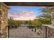 Balcony view showcasing desert landscape, cacti, and sunset sky at 9290 E Thompson Peak Pkwy # 470, Scottsdale, AZ 85255