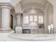Stylish bar area with custom cabinets, granite countertops, stainless steel appliances, and elegant lighting at 9290 E Thompson Peak Pkwy # 470, Scottsdale, AZ 85255