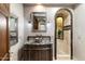 Luxurious bathroom with vanity, vessel sink, mirror, and arched tiled shower stall at 9290 E Thompson Peak Pkwy # 470, Scottsdale, AZ 85255