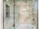 Modern bathroom featuring glass shower door, tiled walls and shower niche at 9290 E Thompson Peak Pkwy # 470, Scottsdale, AZ 85255