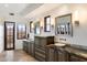 Bright bathroom featuring double vanities with granite countertops, vessel sinks, and views of the outside scenery at 9290 E Thompson Peak Pkwy # 470, Scottsdale, AZ 85255