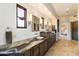 Bathroom featuring dual vanities, a large window, and custom cabinetry at 9290 E Thompson Peak Pkwy # 470, Scottsdale, AZ 85255