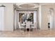 Elegant dining room with a round table, stylish chairs, modern chandelier, and natural light at 9290 E Thompson Peak Pkwy # 470, Scottsdale, AZ 85255