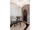 Charming entryway with a stone accent wall, custom iron door, and stylish bar seating at 9290 E Thompson Peak Pkwy # 470, Scottsdale, AZ 85255