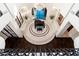 Elegant foyer with piano, chandelier, curved benches, and marble tile flooring, showcasing a luxurious and inviting entrance at 9290 E Thompson Peak Pkwy # 470, Scottsdale, AZ 85255