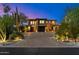 Stunning two-story home with a grand driveway, desert landscaping, and a three-car garage at 9290 E Thompson Peak Pkwy # 470, Scottsdale, AZ 85255