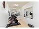 Home gym featuring ample workout equipment, mirrors, and well lit ceilings at 9290 E Thompson Peak Pkwy # 470, Scottsdale, AZ 85255