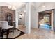 Stately hallway with arched ceilings, travertine floors, and an inviting view of the pool at 9290 E Thompson Peak Pkwy # 470, Scottsdale, AZ 85255