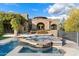 Relaxing backyard hot tub with unique tilework and lush landscaping at 9290 E Thompson Peak Pkwy # 470, Scottsdale, AZ 85255