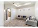 A spacious living room featuring carpet floors, two sofas, recessed lights and an open doorway at 9290 E Thompson Peak Pkwy # 470, Scottsdale, AZ 85255