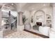 Elegant living room featuring a fireplace, built-in shelving, and neutral-toned seating at 9290 E Thompson Peak Pkwy # 470, Scottsdale, AZ 85255