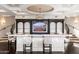Stylish living room features a built-in bar with TV, perfect for entertaining at 9290 E Thompson Peak Pkwy # 470, Scottsdale, AZ 85255