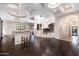 Expansive living area with piano, bar, hardwood floors, and soaring ceilings at 9290 E Thompson Peak Pkwy # 470, Scottsdale, AZ 85255