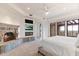 Inviting main bedroom boasting a stone fireplace, TV, and access to a private balcony at 9290 E Thompson Peak Pkwy # 470, Scottsdale, AZ 85255