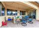 Comfortable covered patio with stylish furniture, creating a relaxing outdoor living space with great views at 9295 W Quail Track Dr, Peoria, AZ 85383