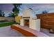 Outdoor fireplace and seating area, perfect for enjoying cool evenings in the backyard at 9295 W Quail Track Dr, Peoria, AZ 85383