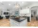 Spacious kitchen with center island, modern appliances, and a layout that opens to the connected living area at 9295 W Quail Track Dr, Peoria, AZ 85383
