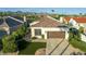 Inviting home exterior with well-kept lawn, tile roof, and modern garage door at 9457 N 115Th St, Scottsdale, AZ 85259